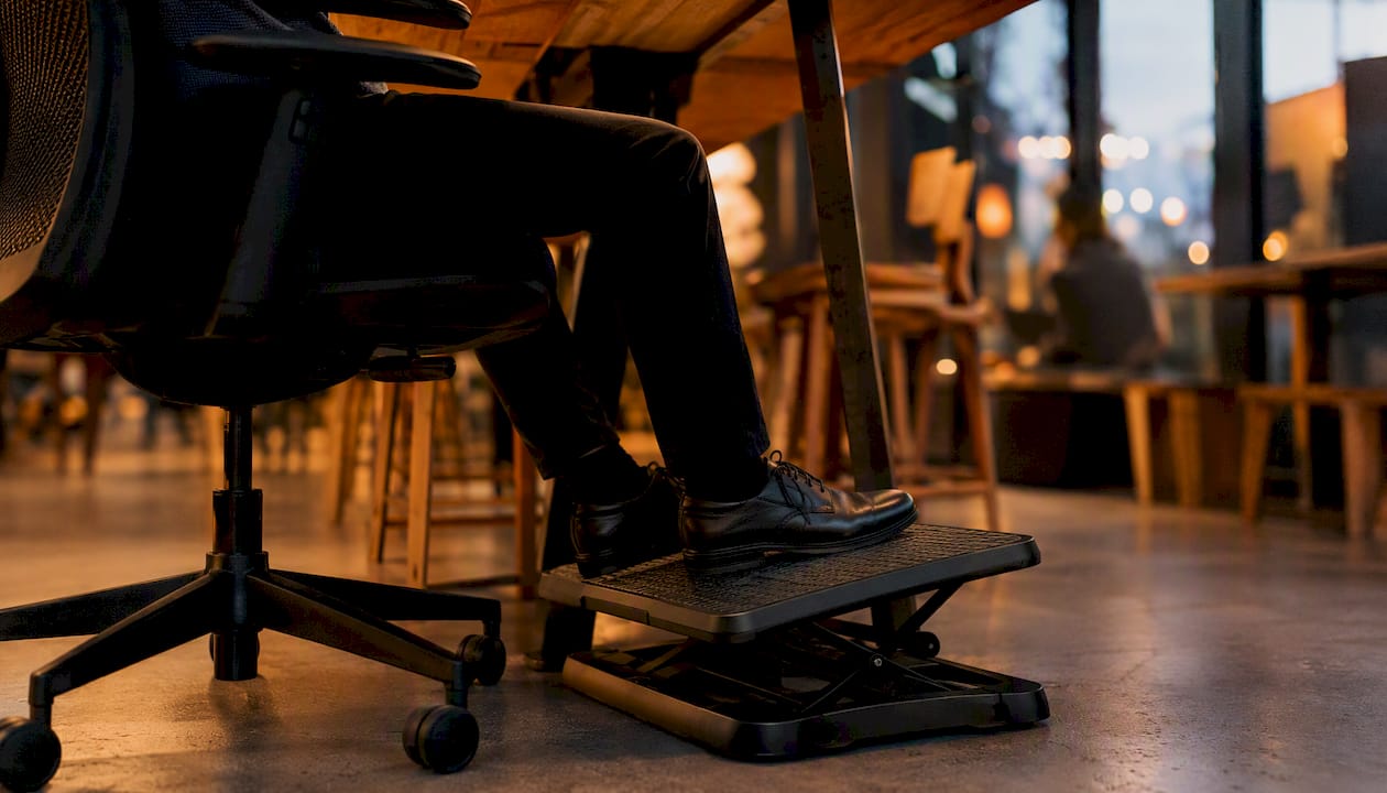 Feet resting on footrest promoting circulation