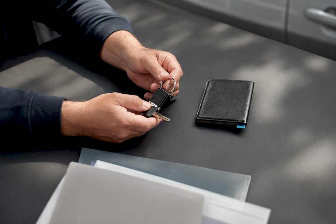 Keys and documents arranged for safe vehicle handover