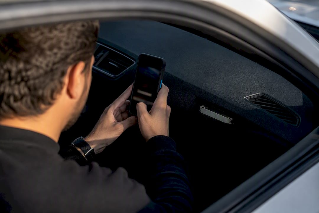 Buyer photographing a vehicle VIN label