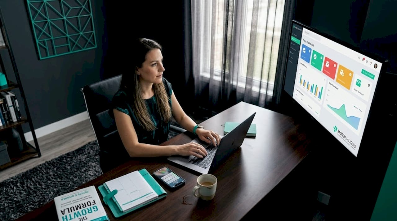 E-commerce manager working at dashboard in home office