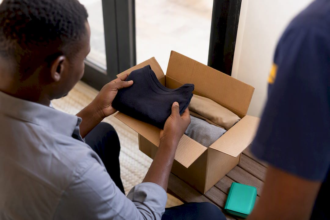 Customer inspecting parcel before COD payment