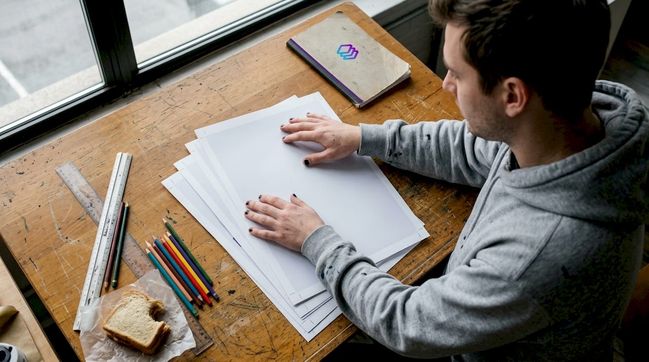 Designer demonstrates print bleed on posters