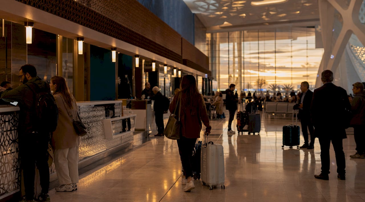How to Book Flights to Morocco: Guide 2 Casablanca airport exterior with travelers