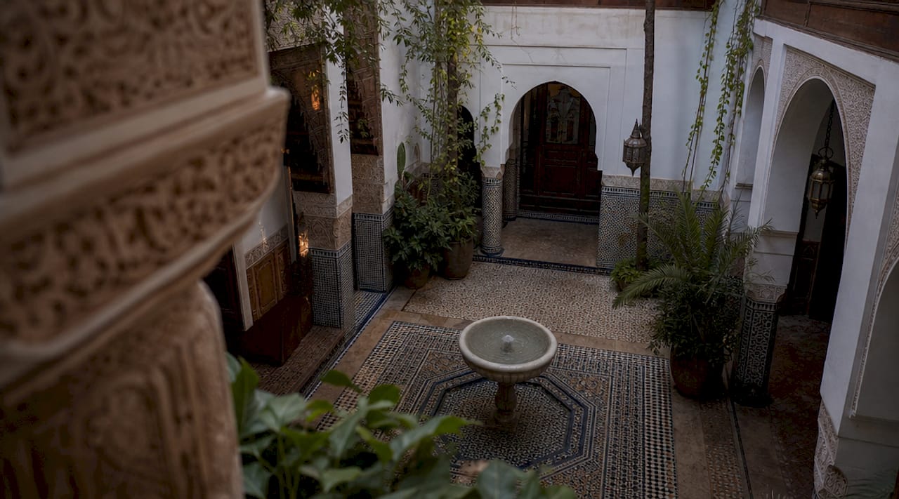 Traditional riad courtyard with fountain and arches