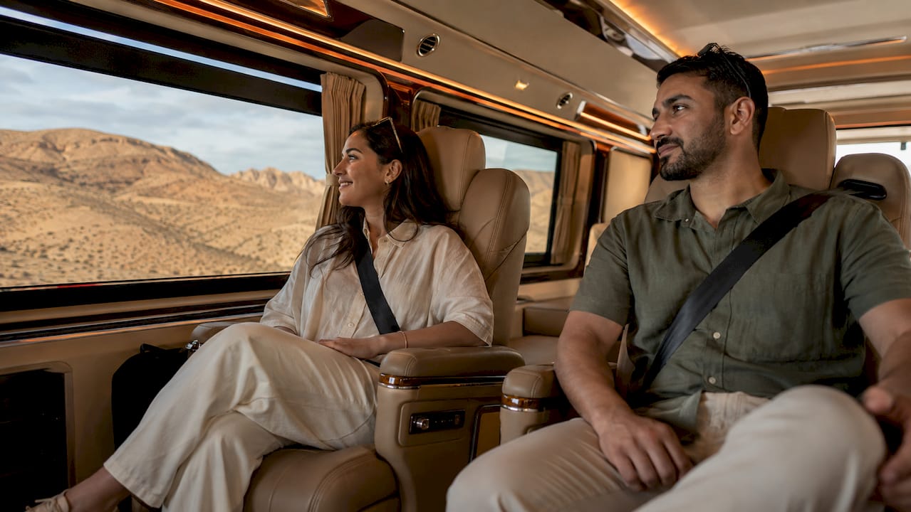 Morocco Luxury Tourism Transport: The Definitive Guide 2 Luxury van interior with passengers and desert view