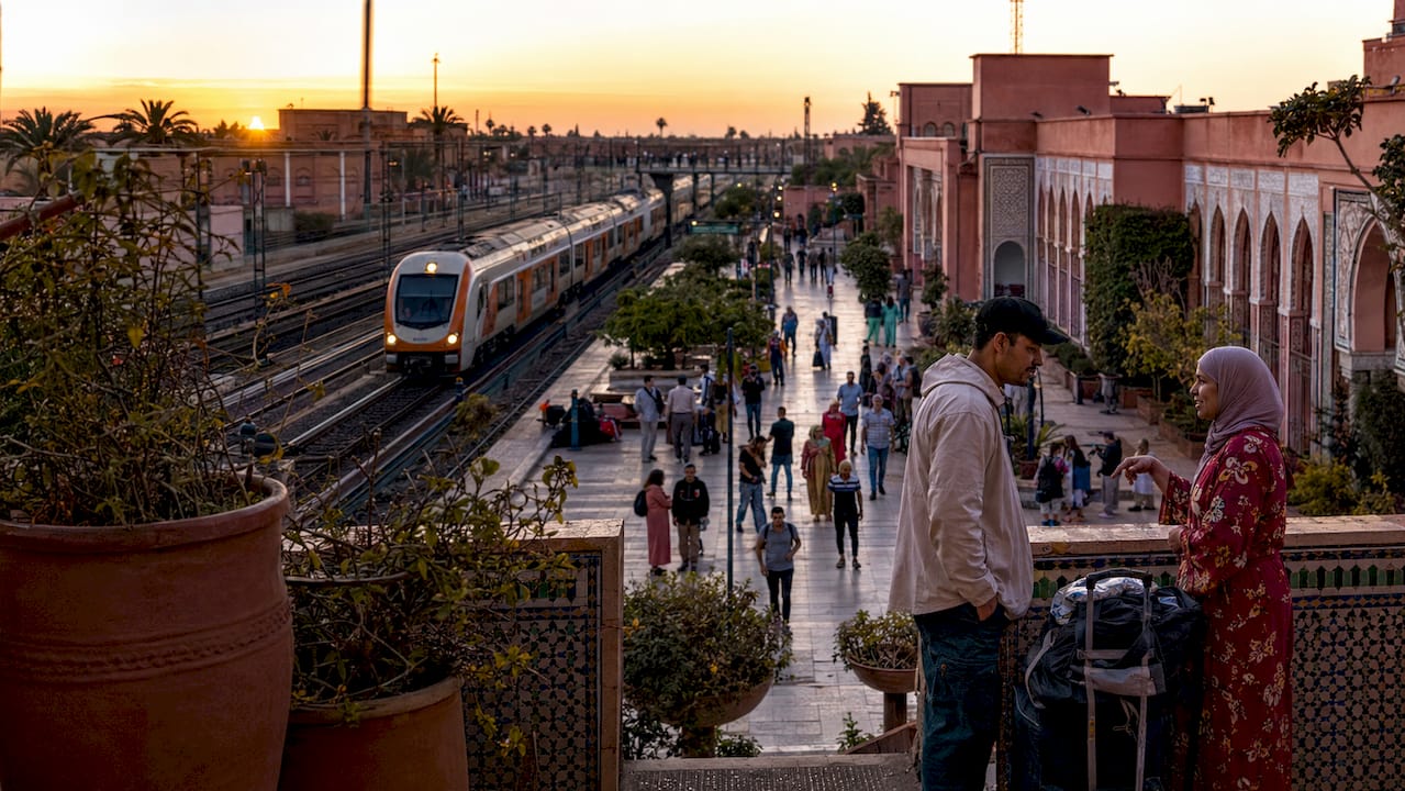 Moroccan train arrival at busy station platform