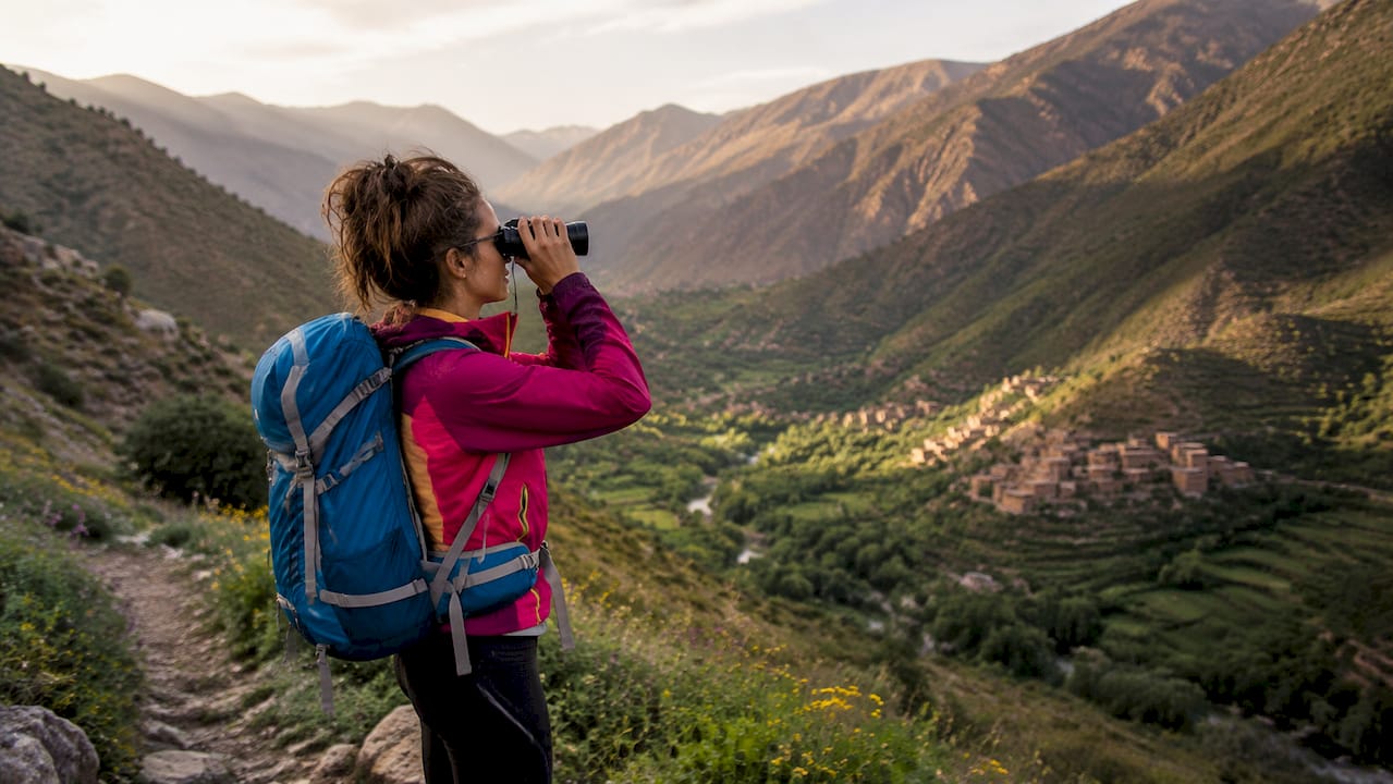 Marrakech Tours: Cultural Experiences & Day Trips 2 Hiker enjoying view of Ourika Valley mountains