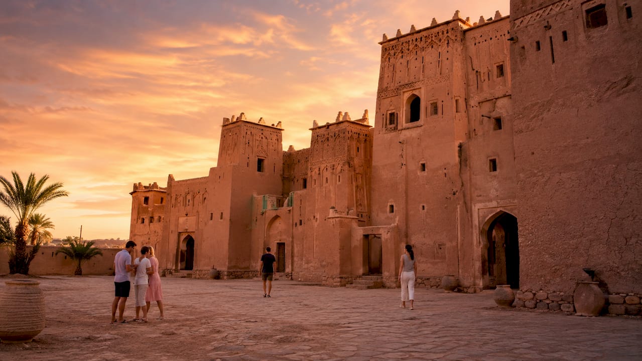 Kasbah Taourirt walls and visitors in daylight