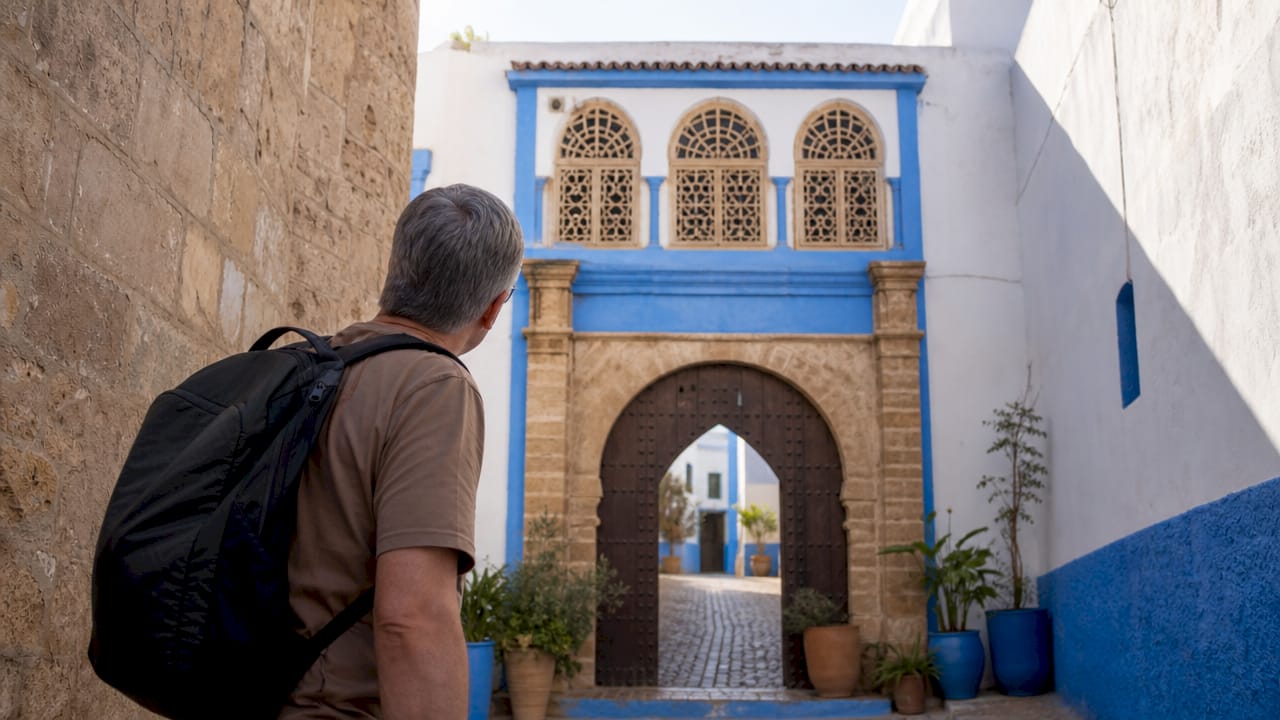 Tourist at Kasbah of the Udayas entrance gate