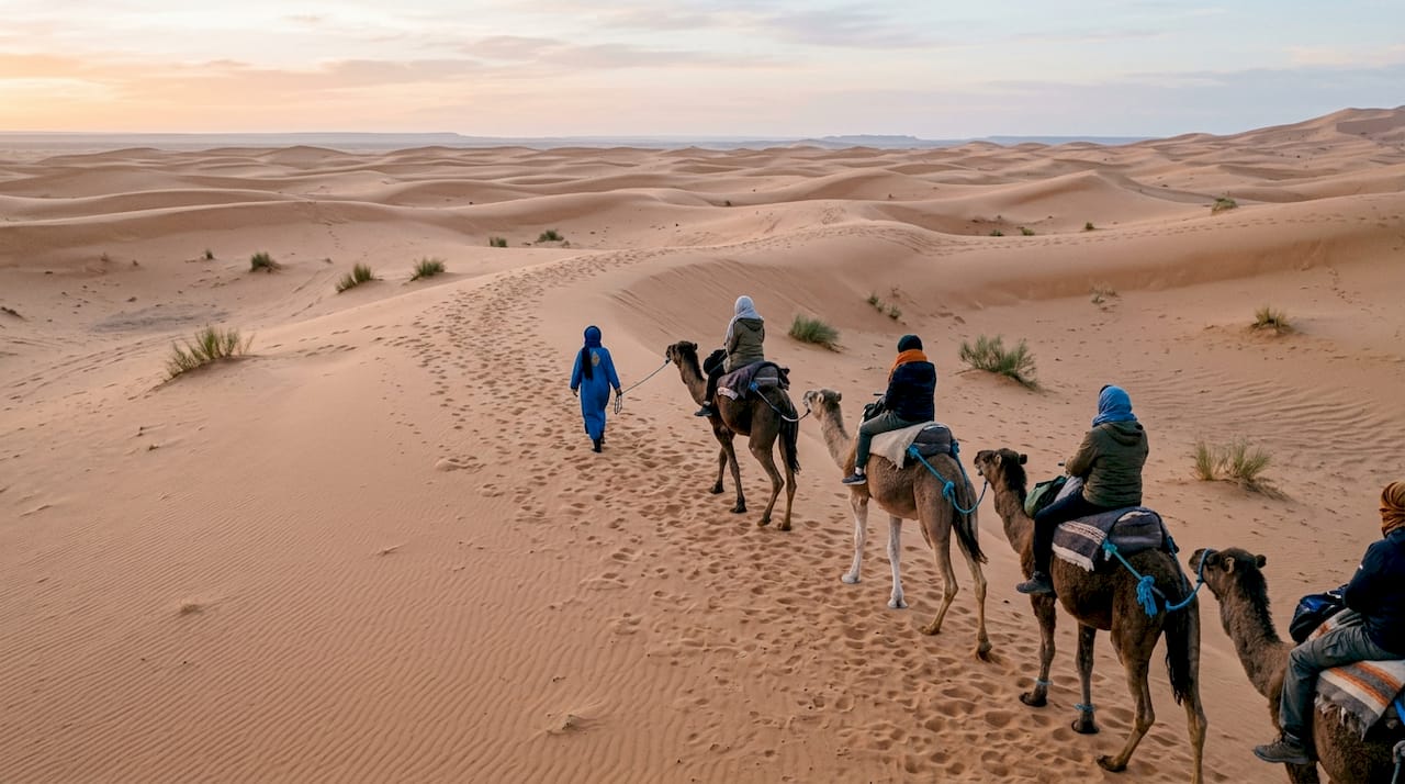 Marrakech, Sahara, and Chefchaouen: Travel Guide 2 Camel trek on Sahara desert dunes at sunset