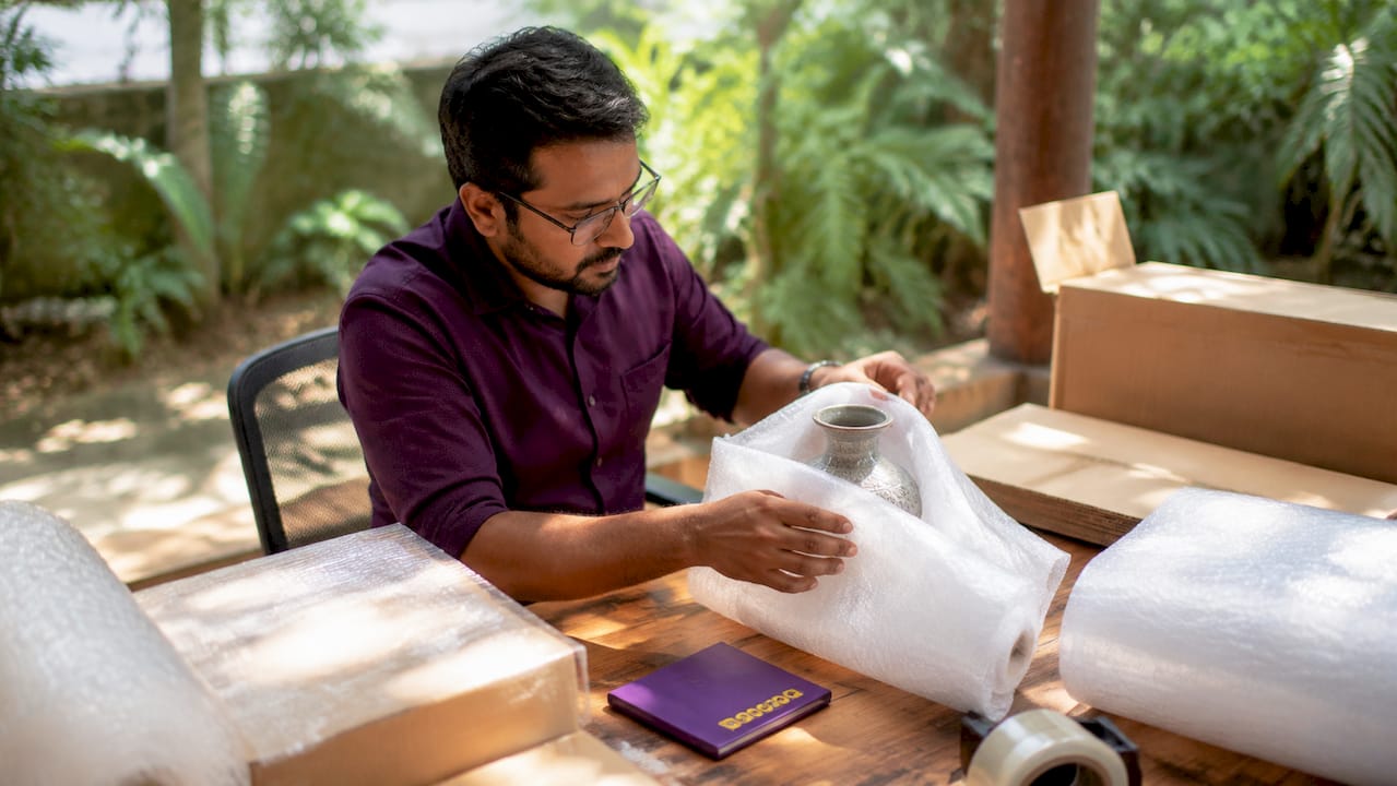 Engineer wrapping fragile item with protective foam