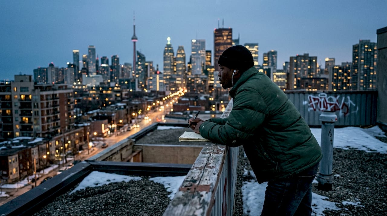 Canadian rapper looking over Toronto skyline