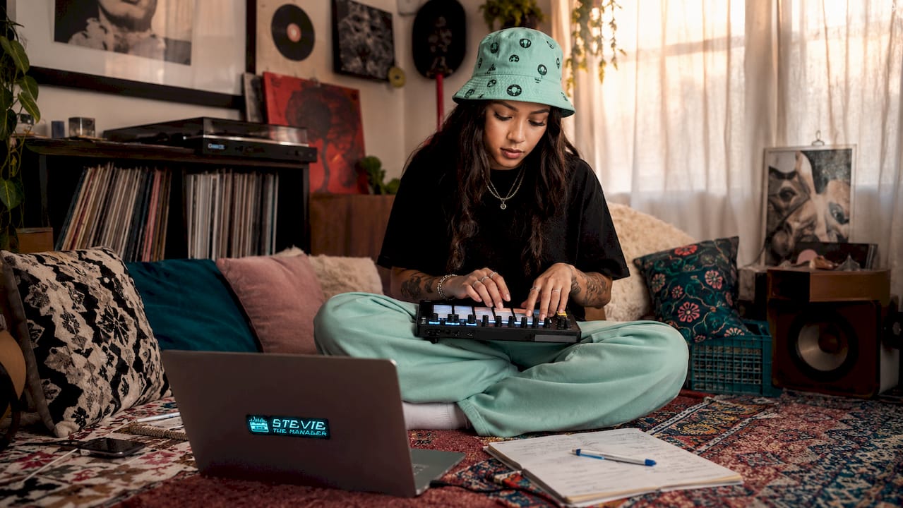 Underground hip-hop artist creating beats at home