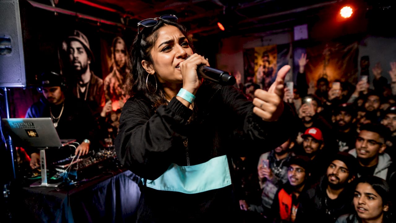 Female rapper performing live at festival