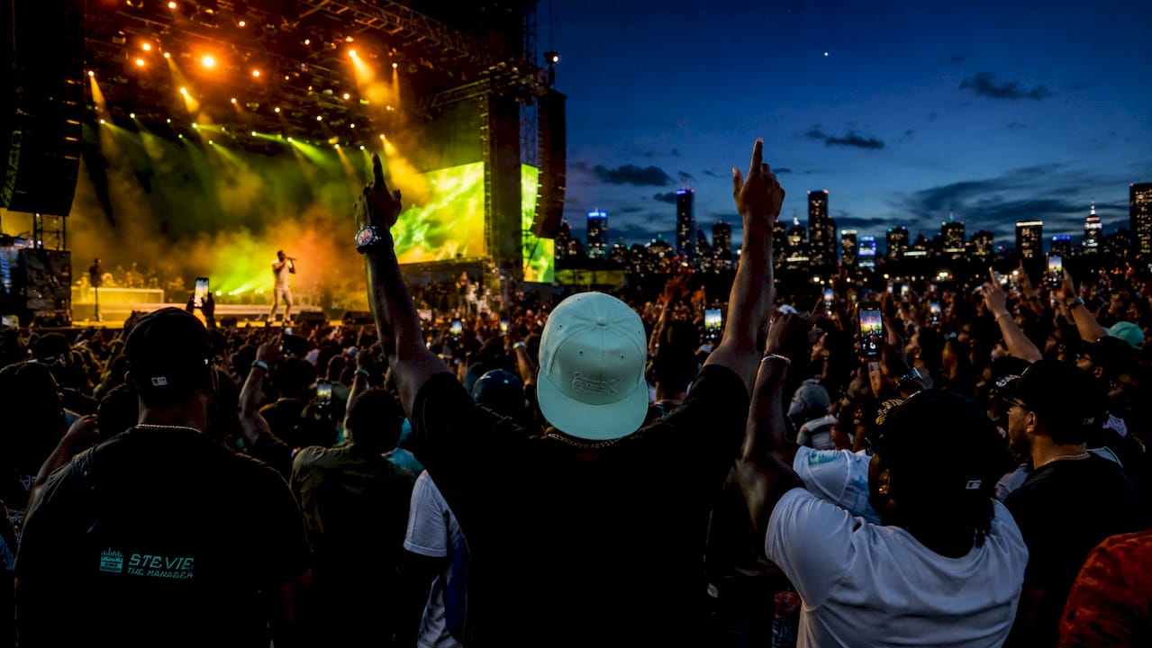 Grand National Tour concert crowd at dusk