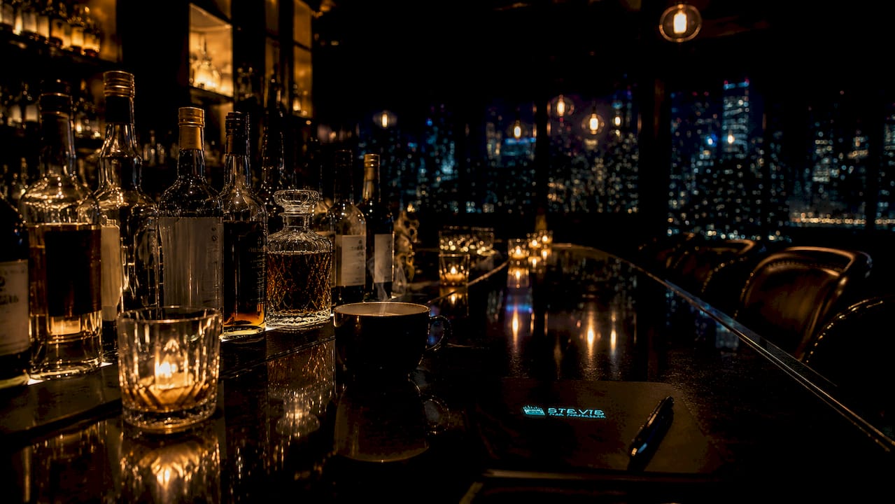 Luxury spirits bottles on wooden bar counter