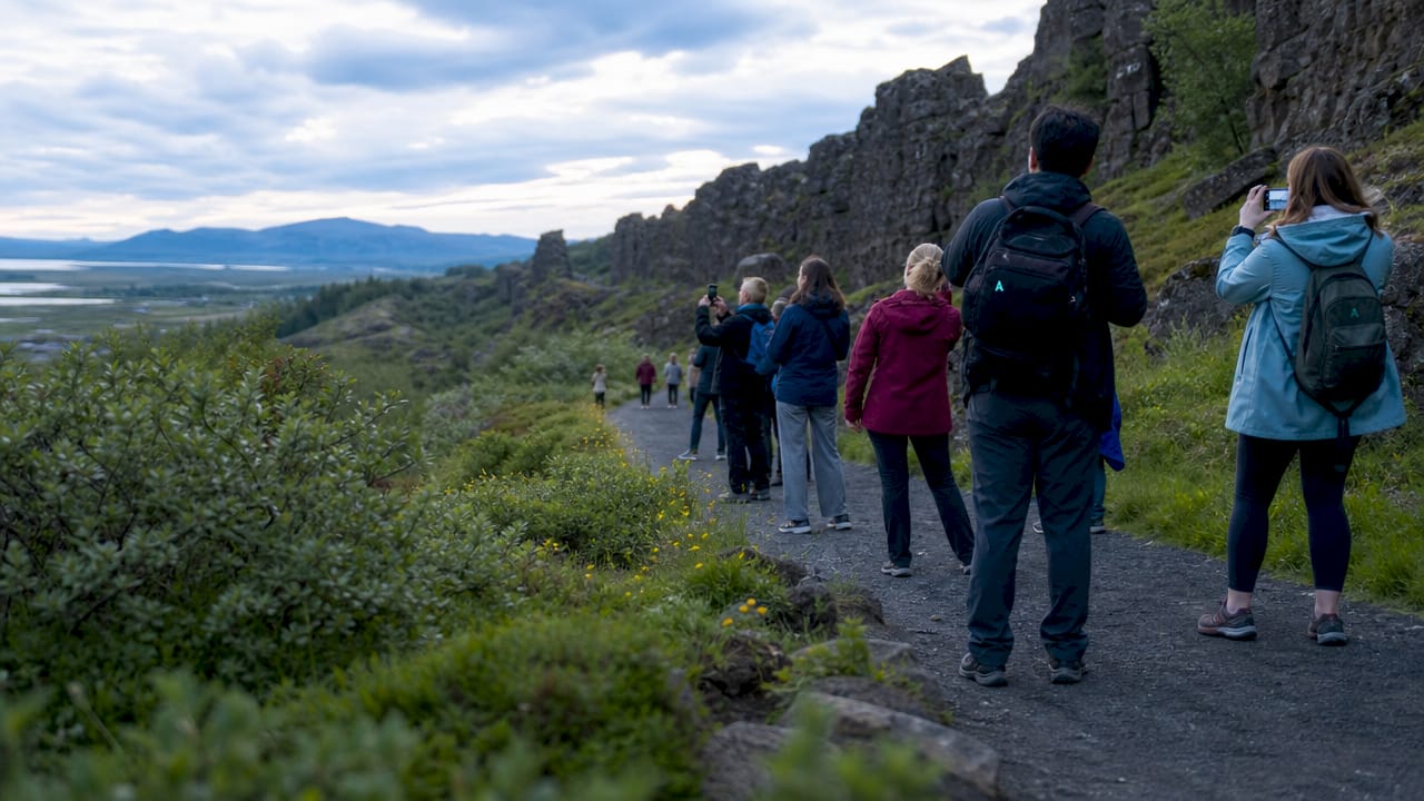 Visitors hiking along Þingvellir trail boardwalk