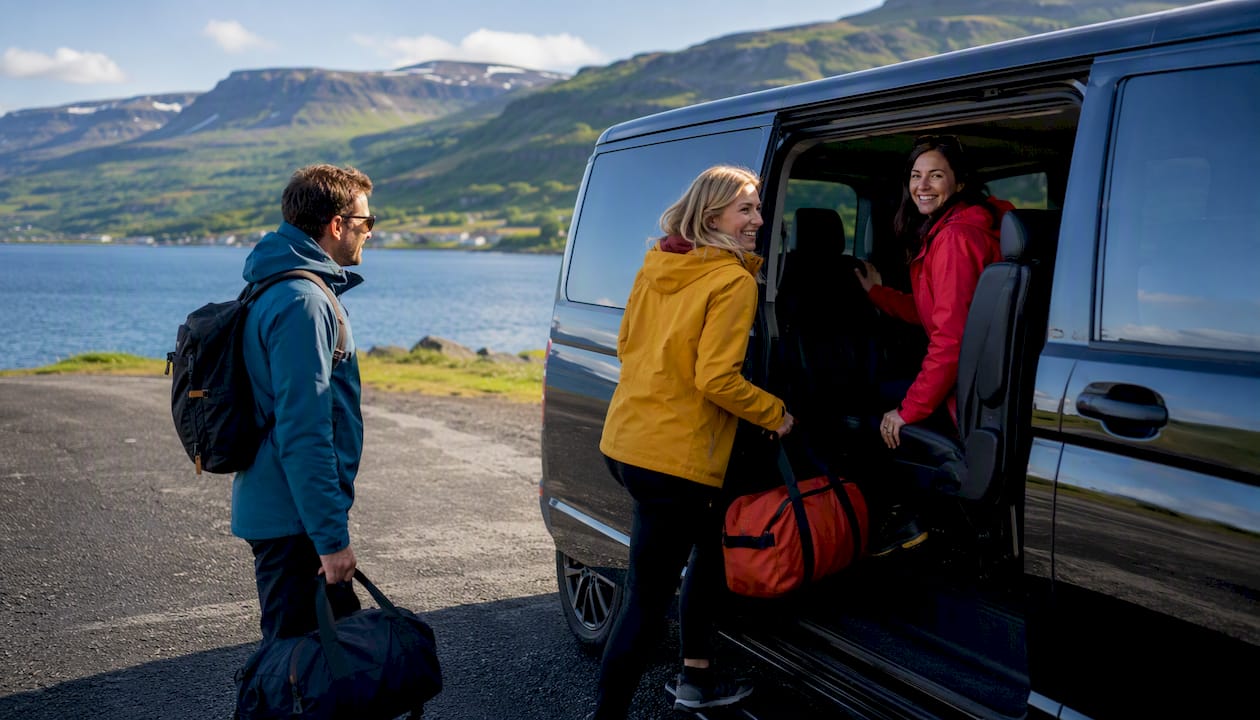 Travelers boarding private transfer vehicle in Iceland