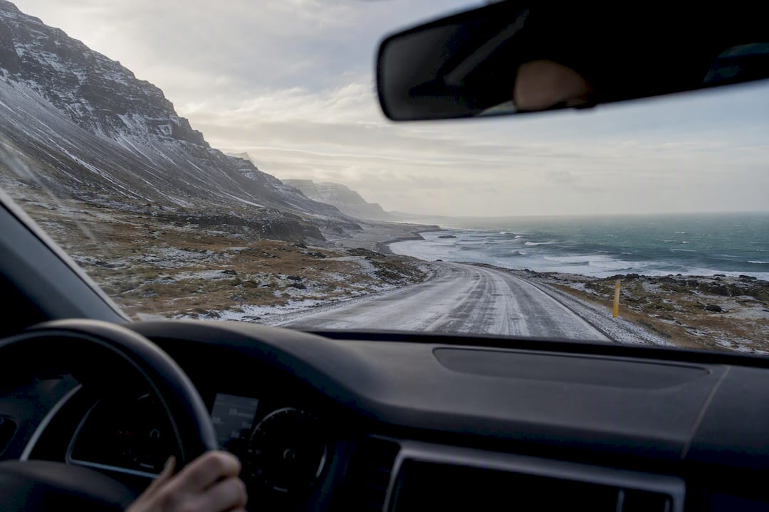 Driving on icy coastal road near Reykjavik