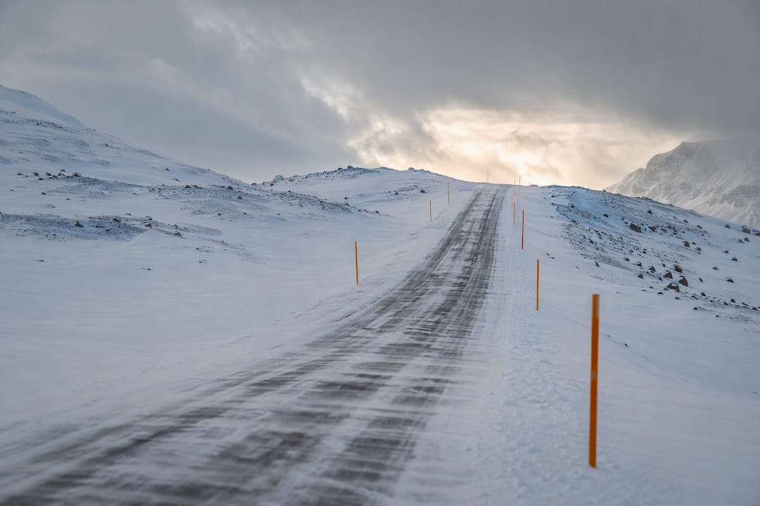 Snow-covered Iceland road through mountain pass