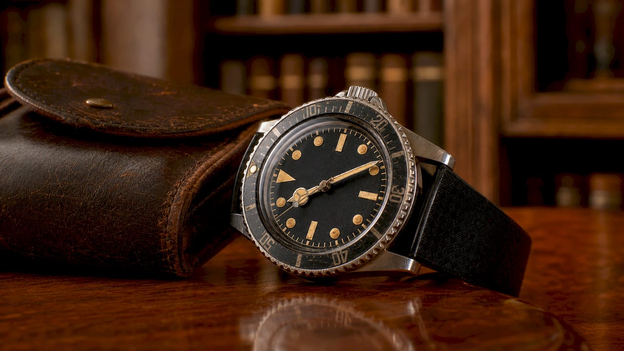 Close-up of vintage watch dial with aged lume