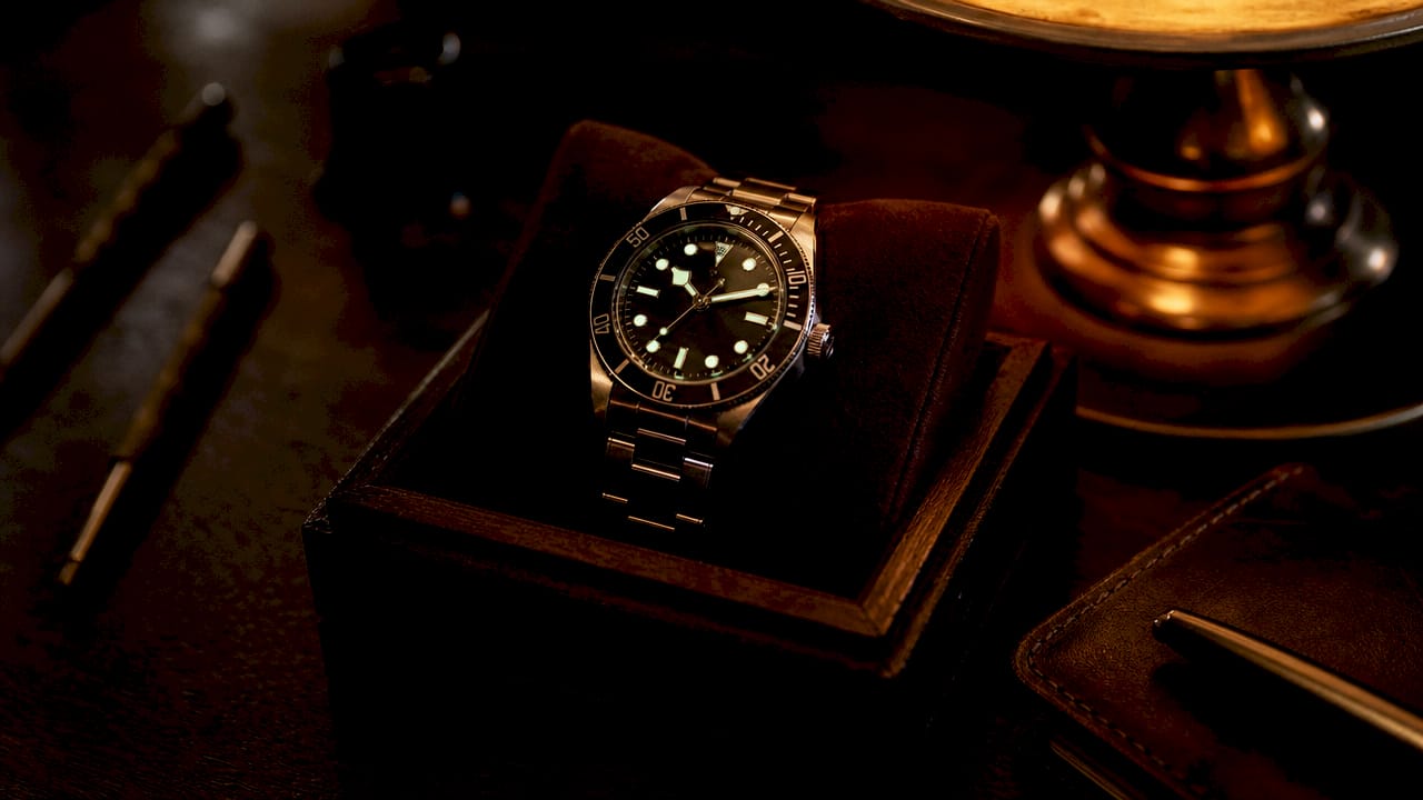 Close-up of watch showing glowing lume