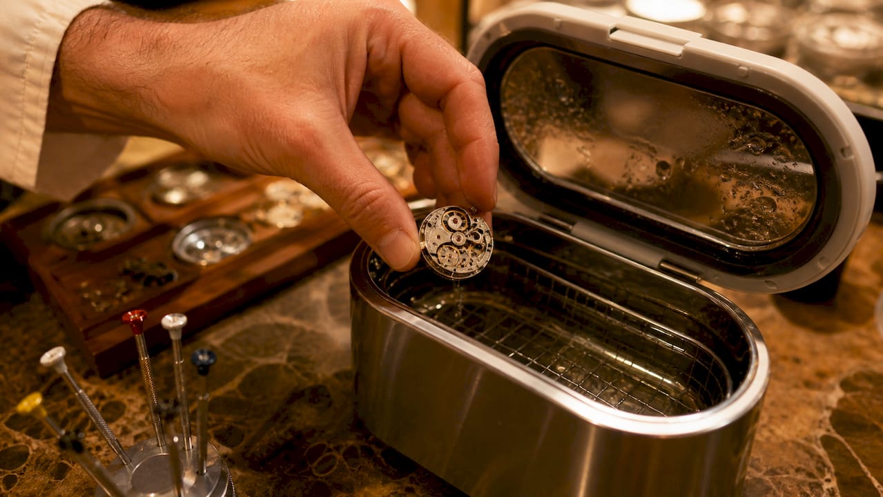 Watch movement loaded into ultrasonic cleaning machine
