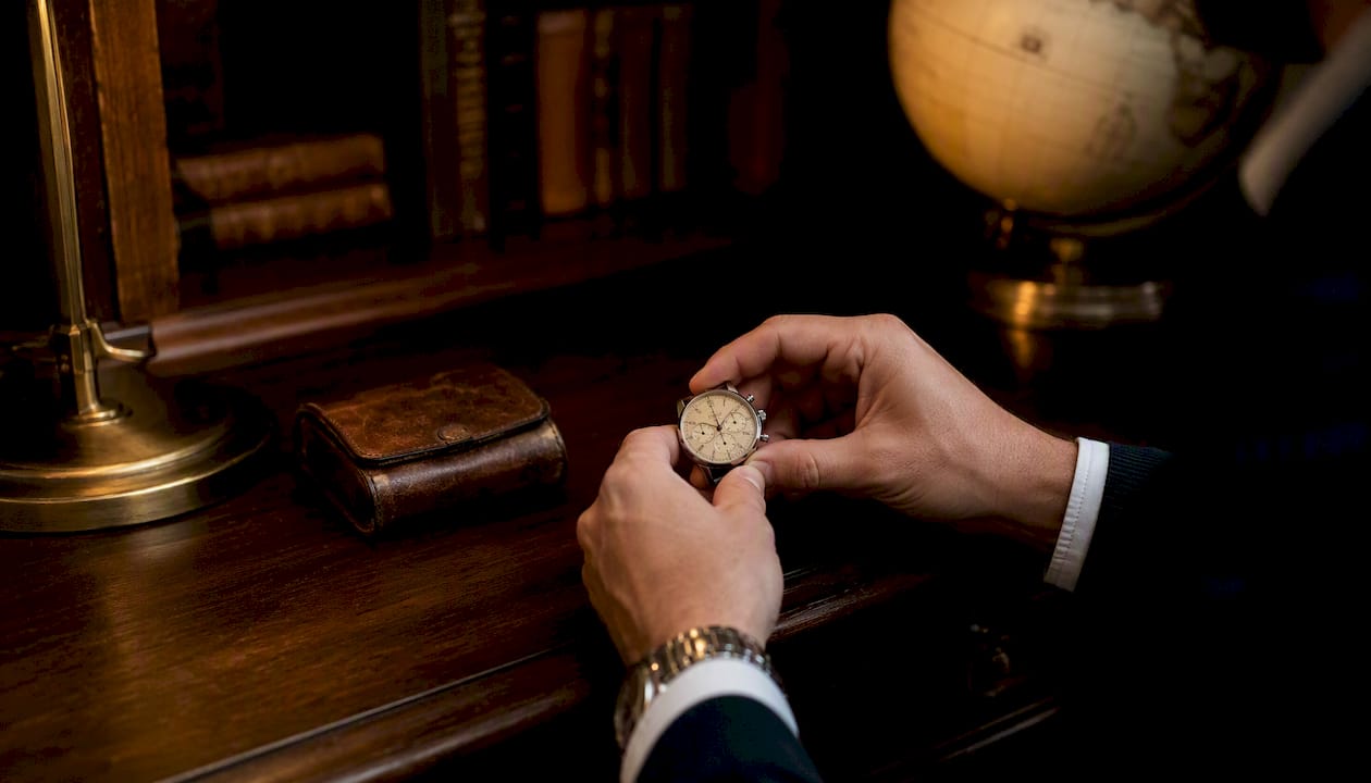 Collector examining luxury watch dial