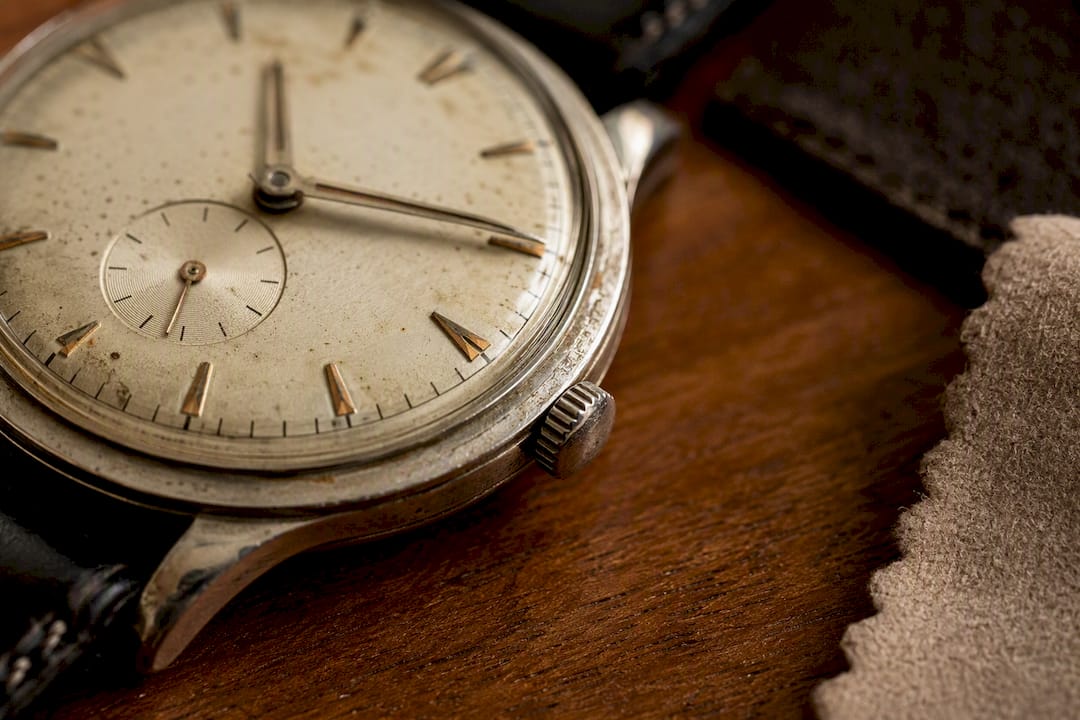 Close-up of vintage luxury watch dial and case patina