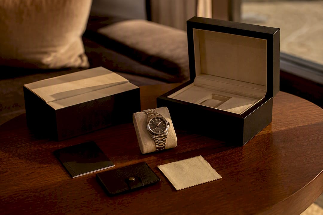 Full set of luxury watch components arranged on table