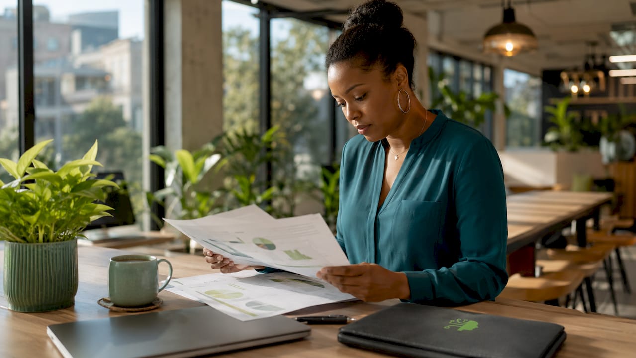 Marketing analyst reviewing lead cost reports