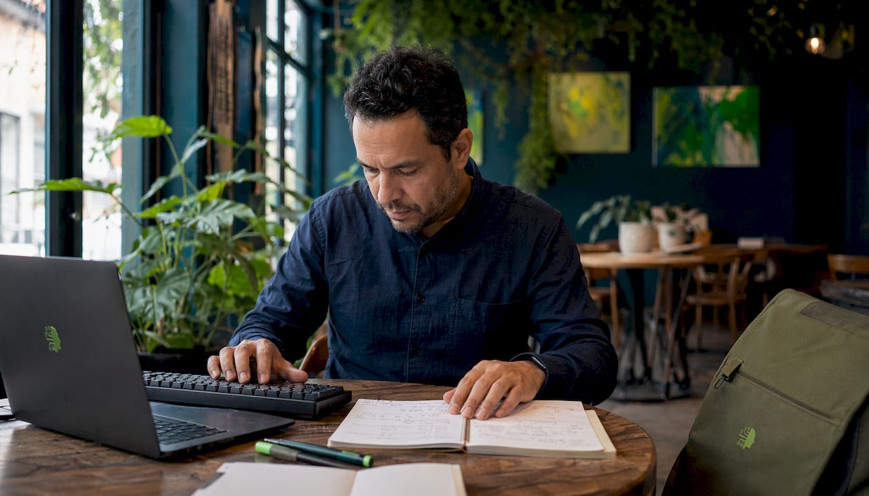 Hands typing and note-taking for prospecting data
