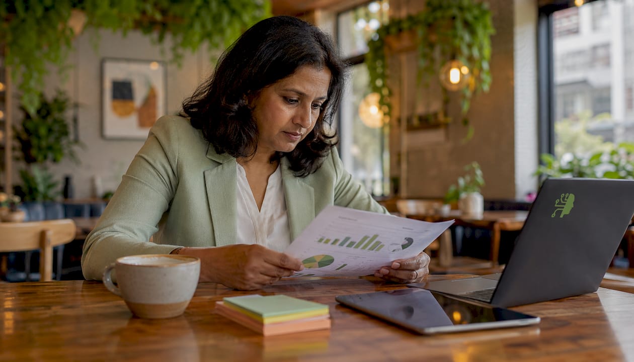Businesswoman reviewing B2B revenue charts