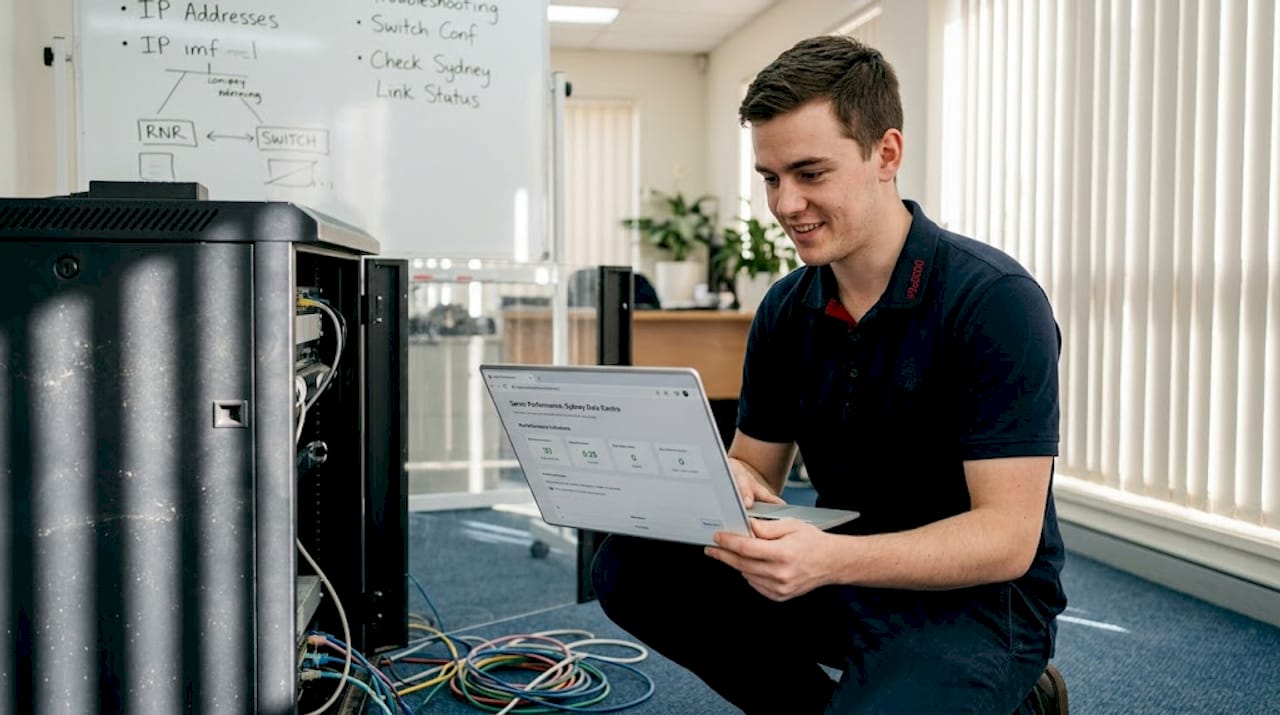 IT technician checks server in Canberra office