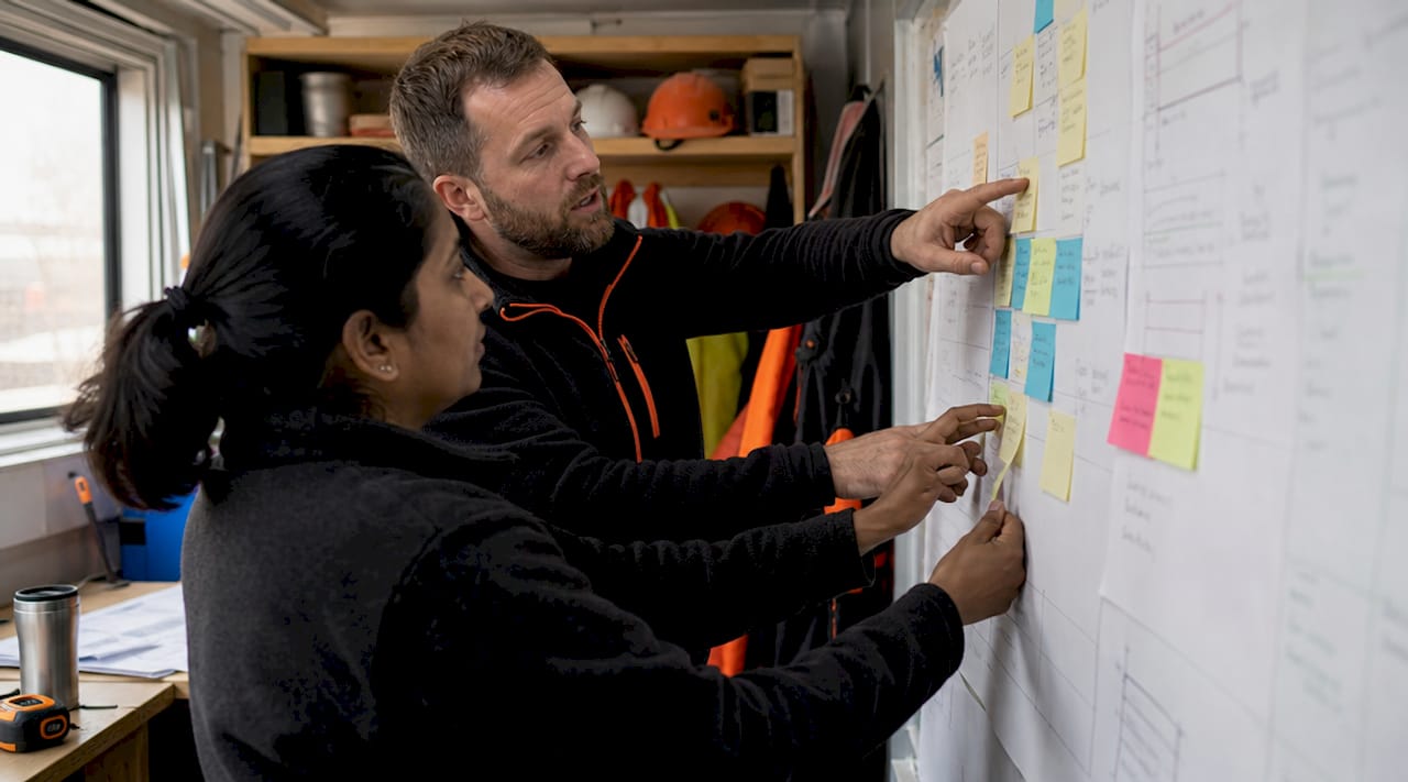 Hands interacting with digital task board