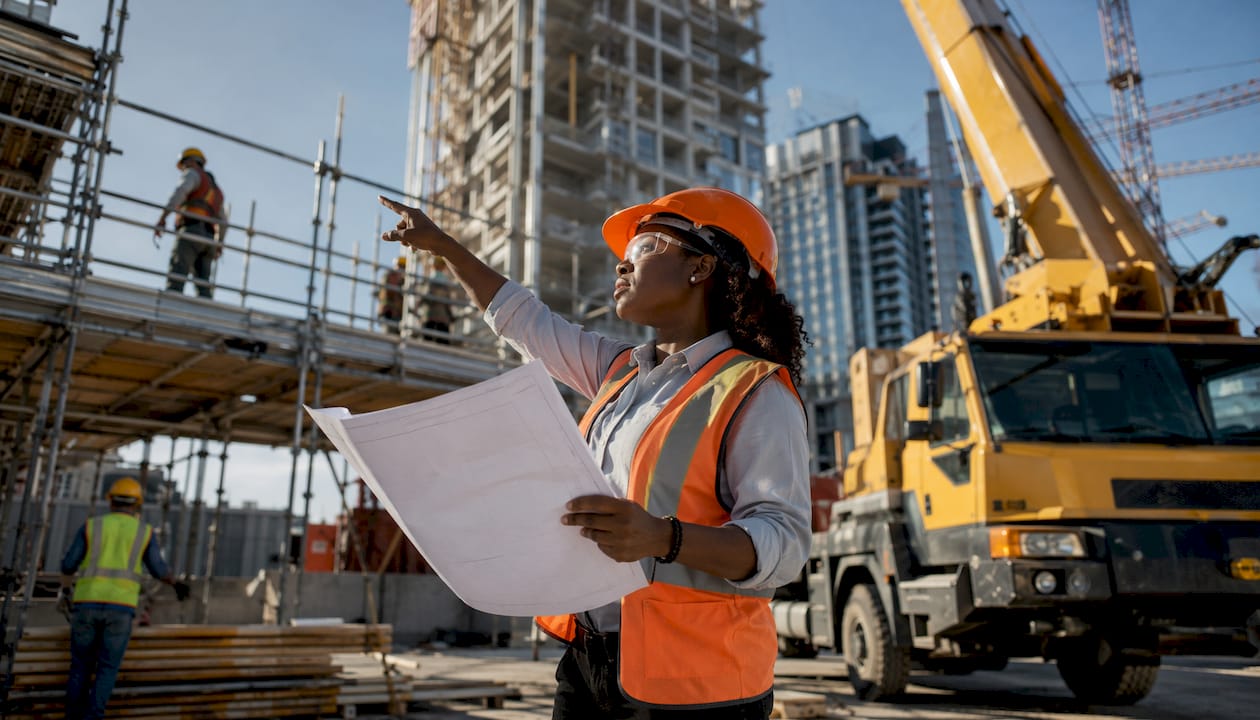 Diverse UK construction site with site manager and workers