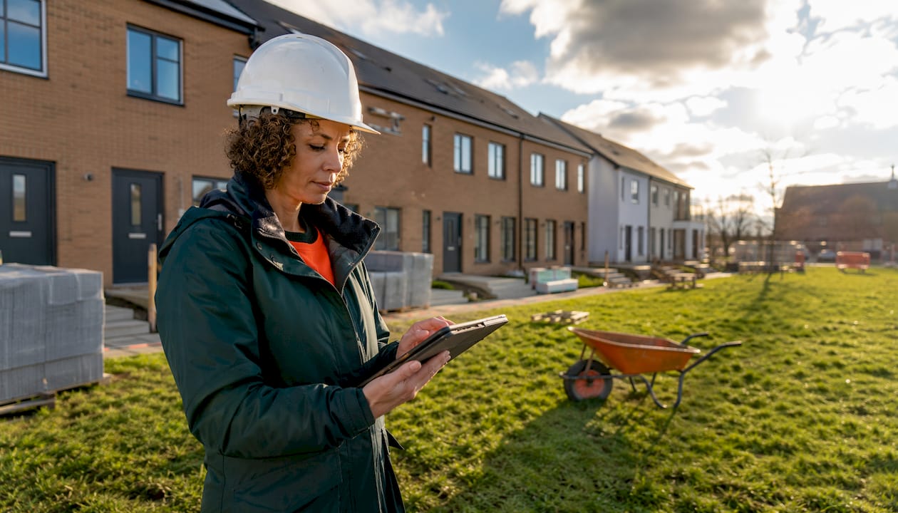 Site manager logging snags on tablet outdoors