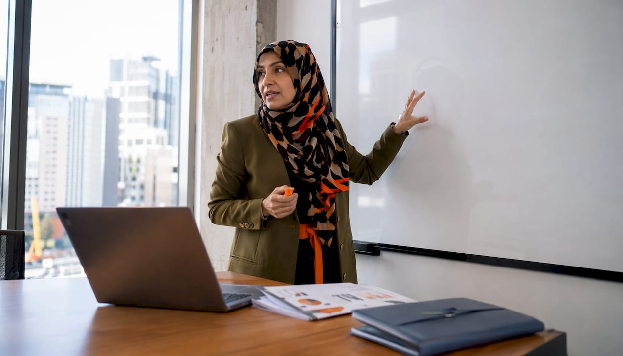 Professional woman presenting KPI benchmarking data