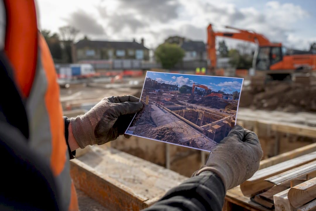 Hands holding timestamped on-site photo print
