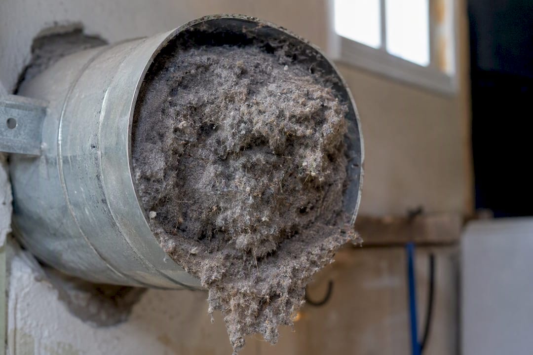 Lint buildup blocking dryer vent pipe