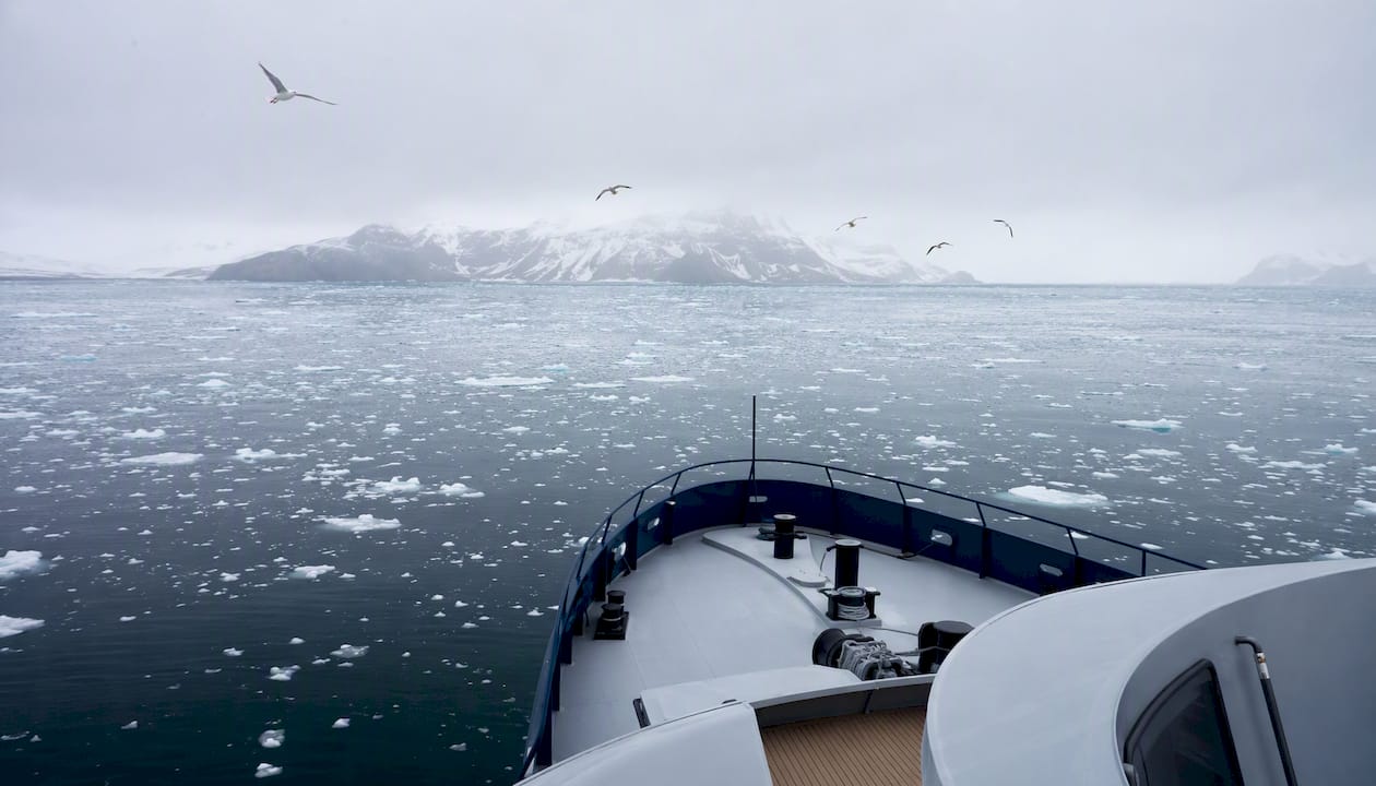 Expedition yacht navigating icy Arctic waters
