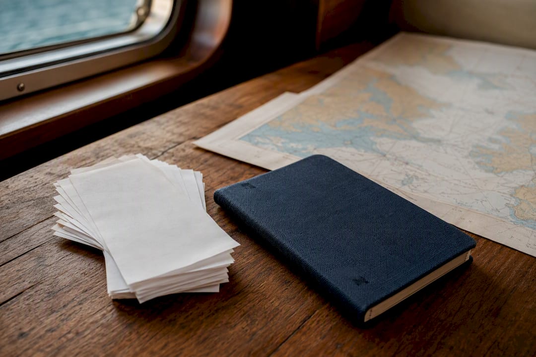 Receipts and nautical tools on yacht table