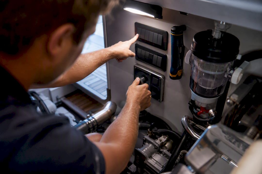 Technician demonstrating yacht engine controls