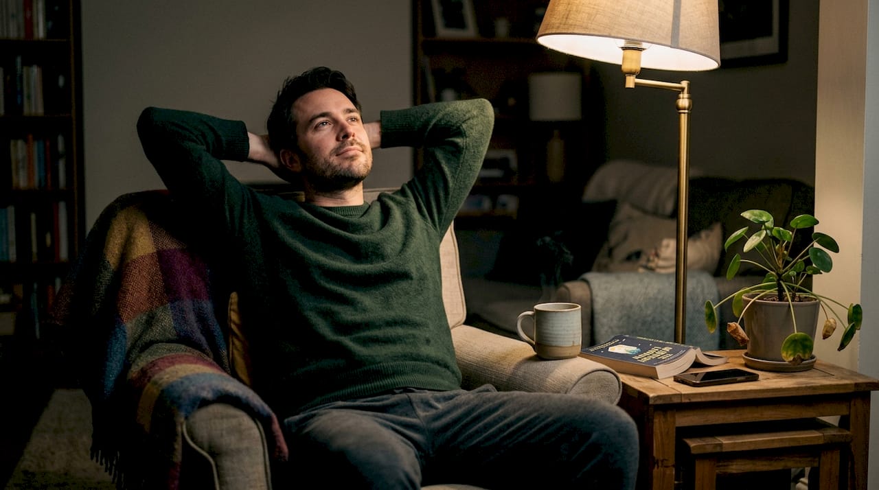 Man relaxing in living room before sleep