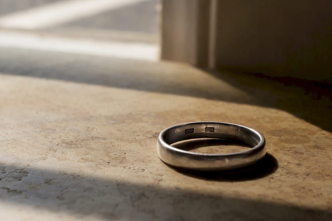 Platinum wedding ring showing patina and texture