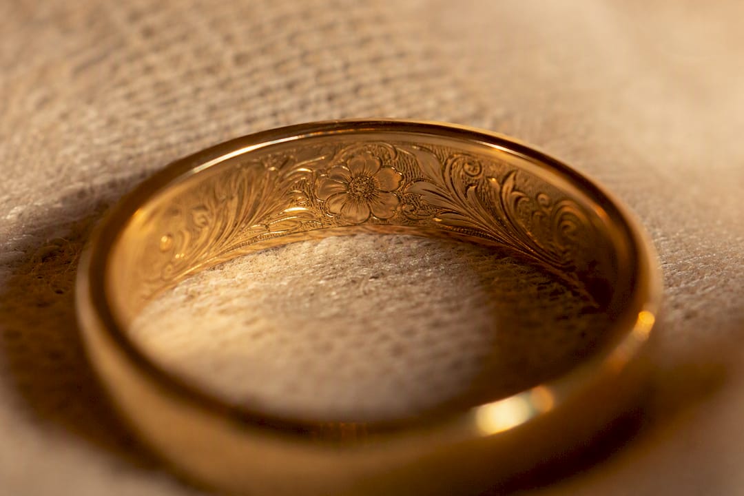 Gold ring with roman numeral engraving