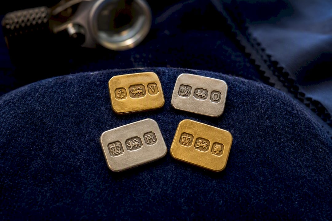 Macro of four UK assay office hallmark stamps