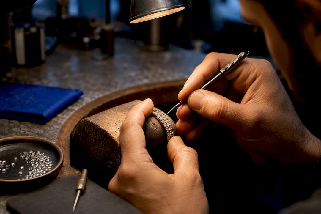 Jeweller hand-setting stones into jewellery