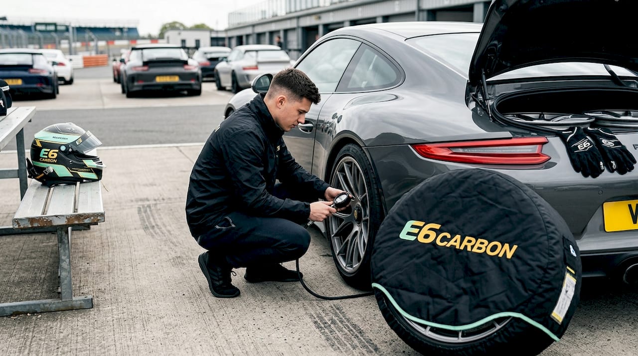 Driver checking track day wheel setup