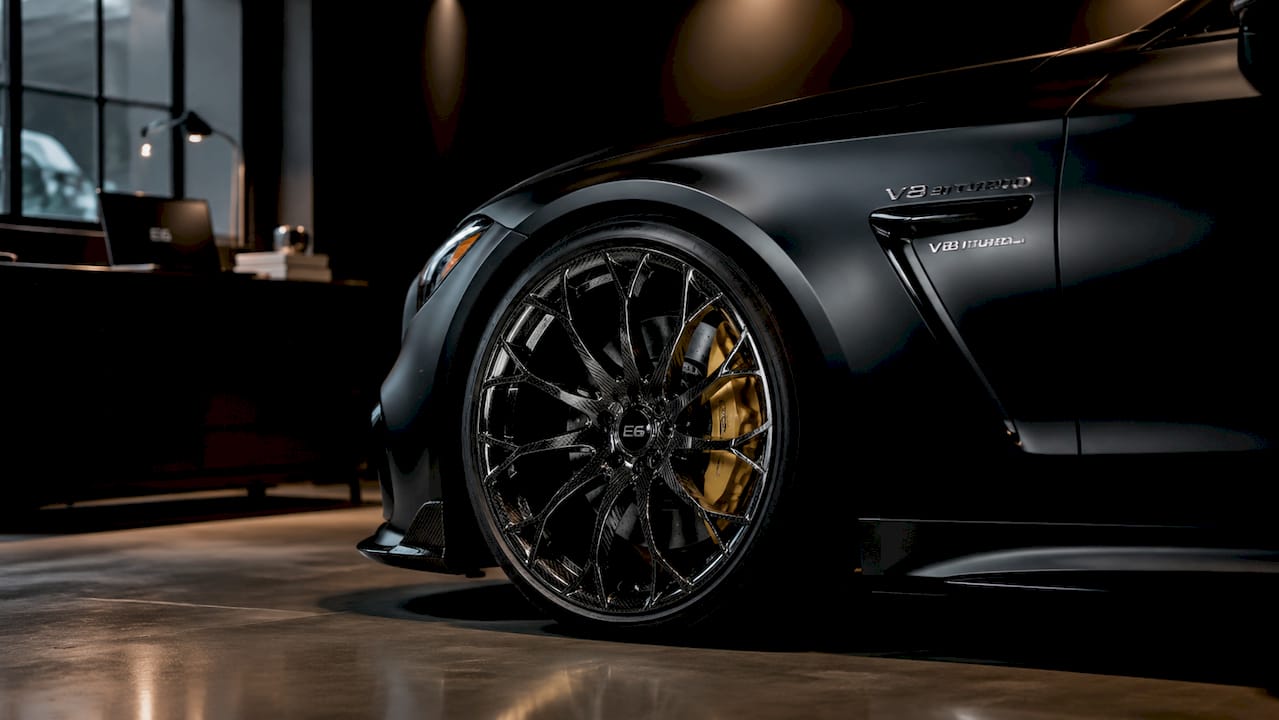 Close-up of directional spoke pattern on luxury car wheel